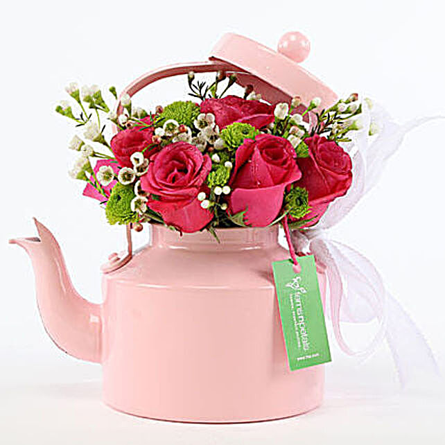 pink roses in teapot