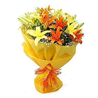 Color Me Up - Bunch of 8 yellow and orange asiatic lilies in dual paper packing.