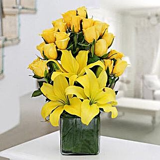Glass vase arrangement of 20 yellow roses and 3 yellow asiatic lilies
