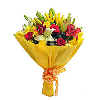 Bunch of 4 red roses, 4 yellow roses, 4 yellow asiatic lilies, 2 red asiatic lilies and seasonal filler
