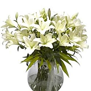 Refined Beauty - Arrangement of 15 white lilies in a glass vase.